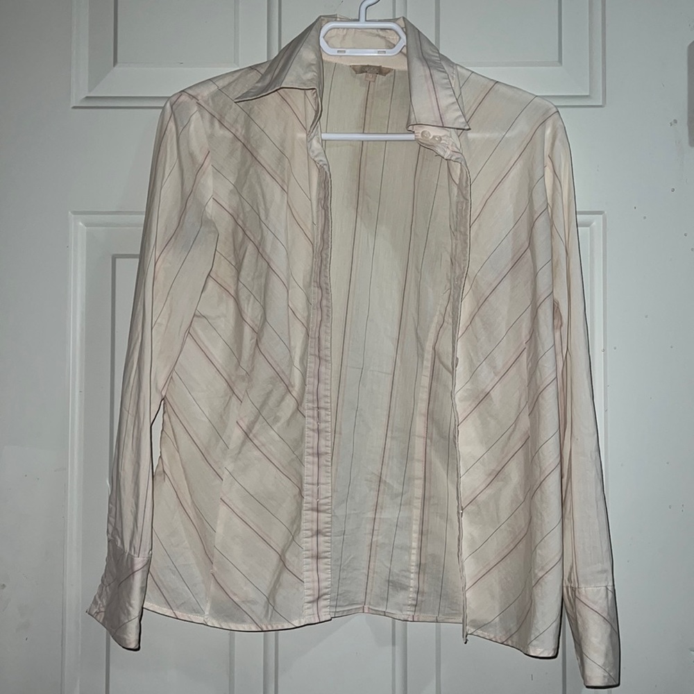 Cream-coloured button down shirt with black pinstripes